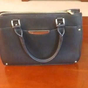 Ann Taylor black faux leather handbag, 8 in. X 12 in. with brass accents.